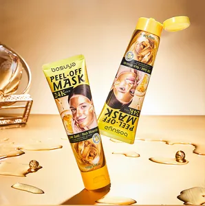 Detail shot of two 24K Gold peel-off face mask tubes on a luxurious golden background