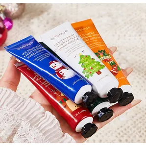 Detail shot of Bosuya Christmas hand cream tubes featuring festive holiday illustrations