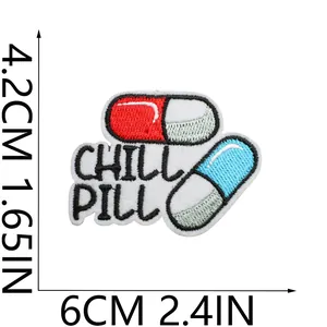 Close-up of 'CHILL PILL' embroidery patch with 4.2x6cm size dimensions for clothing