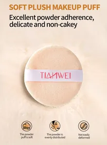 Detail view of a soft plush makeup puff showing delicate texture and TIANWEI branding