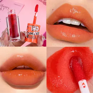 Close-up detail of glossy orange gel lip tint showing application effect and vibrant texture