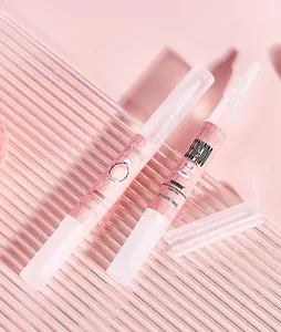 Close-up of FORMBO portable solid fragrance pen with brush tip and pink decorative label