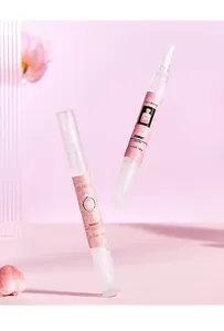 Detailed macro view of two FORMBO portable fragrance pens featuring brush applicators