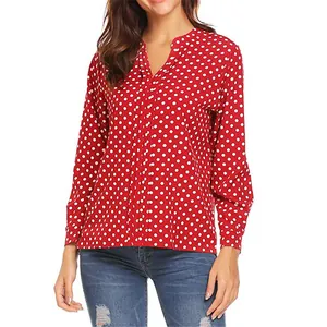 Detailed view of a red polka dot long sleeve blouse for women with a stylish V-neckline