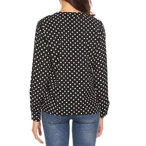 Back view of a black long-sleeve shirt with white polka dot patterns for women