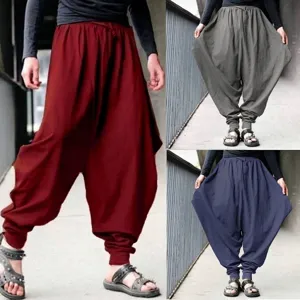 Detailed view of men's loose harem pants in retro burgundy, grey, and navy blue
