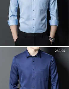 Close-up detail of men's slim fit stretch business shirts in light and dark blue tones.