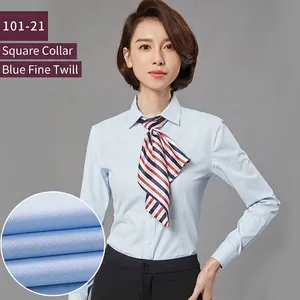 Professional women's slim-fit long-sleeved light blue shirt with striped scarf and detail view