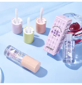 Dettaglio dell'olio per labbra ADMD Crystal Jelly con applicatore e scatola viola
