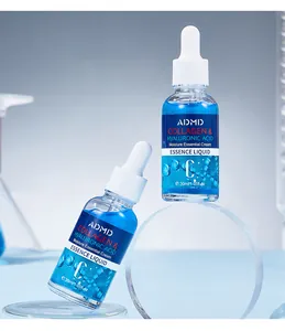 Detailed shot of ADMD collagen and hyaluronic acid essence liquid in 30ml blue bottles