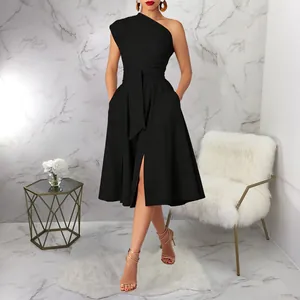 Close-up of elegant one-shoulder black midi dress with waist tie and side slit