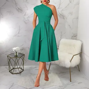 Detailed view of elegant emerald green one-shoulder midi dress with belted cinched waist