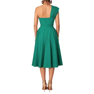 Back view of elegant emerald green one-shoulder dress with waist-cinching flare detail