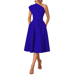 Detailed view of a royal blue one-shoulder dress with a belted waist and pockets