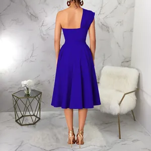 Back view of royal blue one-shoulder cocktail dress with pleated big swing skirt
