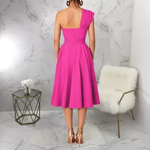 Back view of a vibrant pink one-shoulder midi dress with an elegant flared swing skirt