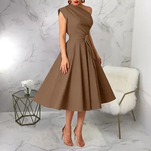 Full length view of elegant one-shoulder brown midi dress with belted waist and flared skirt