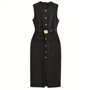 Detailed view of an elegant black sleeveless midi dress with a decorative gold belt buckle.