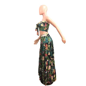 Detailed side view of tropical floral print two-piece beach maxi dress set on mannequin