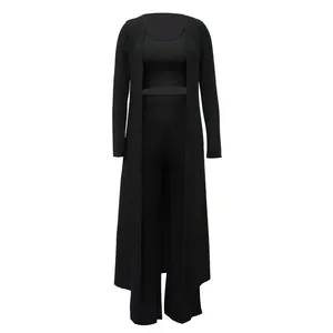 Close-up detail of the three-piece ribbed black outfit including long cardigan.