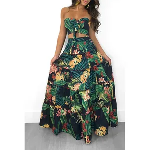Tropical floral print two-piece beach skirt set featuring a tube top and maxi skirt on model