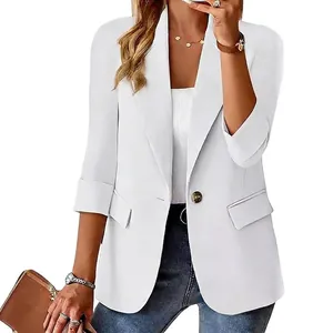 Detailed view of elegant white women's 3/4 sleeve blazer featuring lapel and button detail