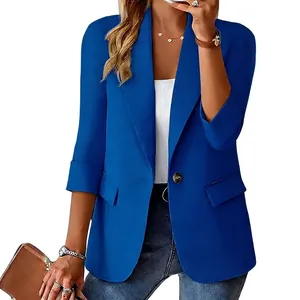 Close-up detail of a women's royal blue three-quarter sleeve blazer with button
