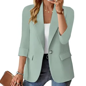 Close-up of elegant sage green women's blazer featuring 3/4 sleeves and single button
