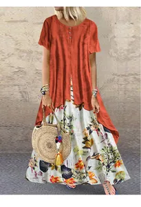 Détail de robe longue bohème en coton et lin à fleurs avec haut orange court