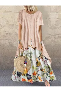 Vue détaillée d'une robe longue bohème à fleurs avec un haut tunique en coton et lin pêche