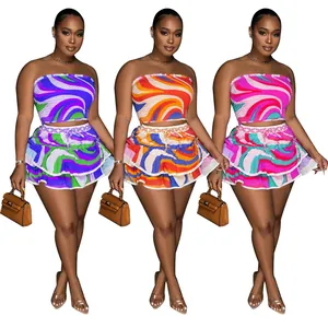 Detail showing three color variations of printed tube top and ruffled mini skirt set.