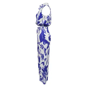 Side view of women's sleeveless crop top and wide-leg trousers in blue floral print.