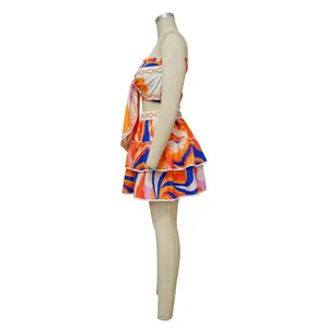Sexy sleeveless printed two-piece skirt set with tie-front crop top and tiered mini skirt