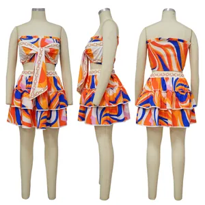 Vibrant abstract print sleeveless crop top and tiered mini skirt set from three angles