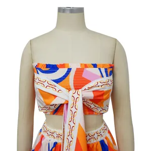 Detail view of a vibrant geometric and chain link print two-piece summer crop top set.