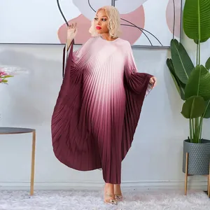 Elegant gradient pleated dress with batwing sleeves in a loose floor-length style.