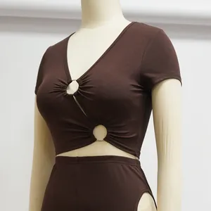 Detail view of brown ribbed two-piece set with V-neck and metal ring cut-outs