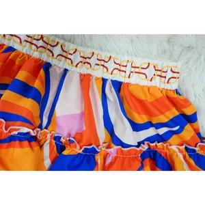 Detailed view of vibrant geometric print skirt with elastic chain pattern waistband