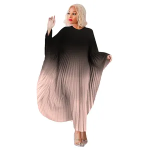 Detail of a plus size gradient pleated dress with flowing batwing sleeves for women.