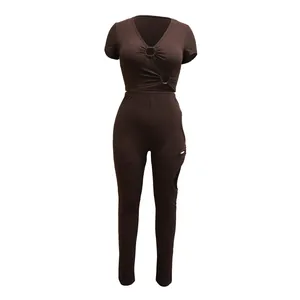 Detail view of brown ribbed two-piece set with V-neck top and side cut-out leggings