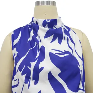 Detail view of stylish blue and white floral print high-neck sleeveless lady top