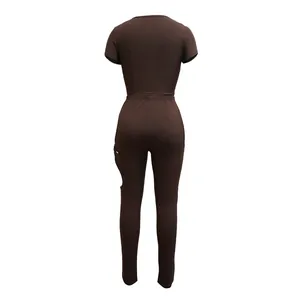 Back view of brown ribbed two-piece set featuring short sleeve top and cutout pants