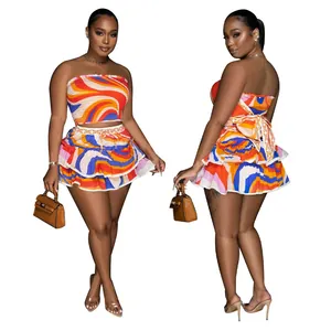 Two-piece colorful printed set with tube top and tiered skirt featuring a back bow tie