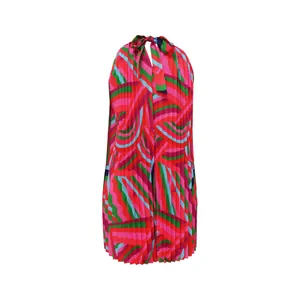 Detail shot of colorful geometric pleated halter dress with tie neck design.
