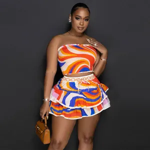 Detail of a two-piece set with vibrant wavy print strapless top and tiered skirt