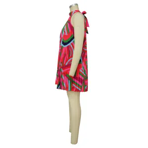 Side view of a sleeveless pleated mini dress with colorful geometric patterns
