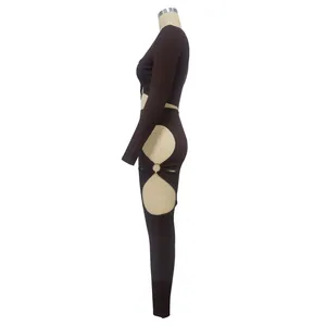 Side view of two-piece ribbed set featuring daring ring cut-outs on leggings.