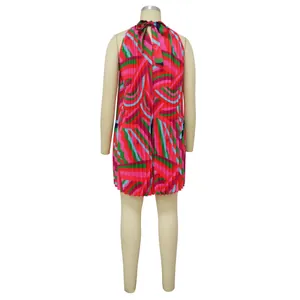 Back detail of a pleated sleeveless dress with vibrant multi-color geometric print.