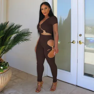 Fashionable two-piece brown cutout set with V-neck top and leggings shown on a model outdoors.