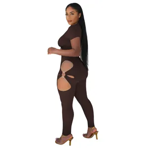 Close-up detail of dark brown short sleeve jumpsuit with sexy side cutouts and ring